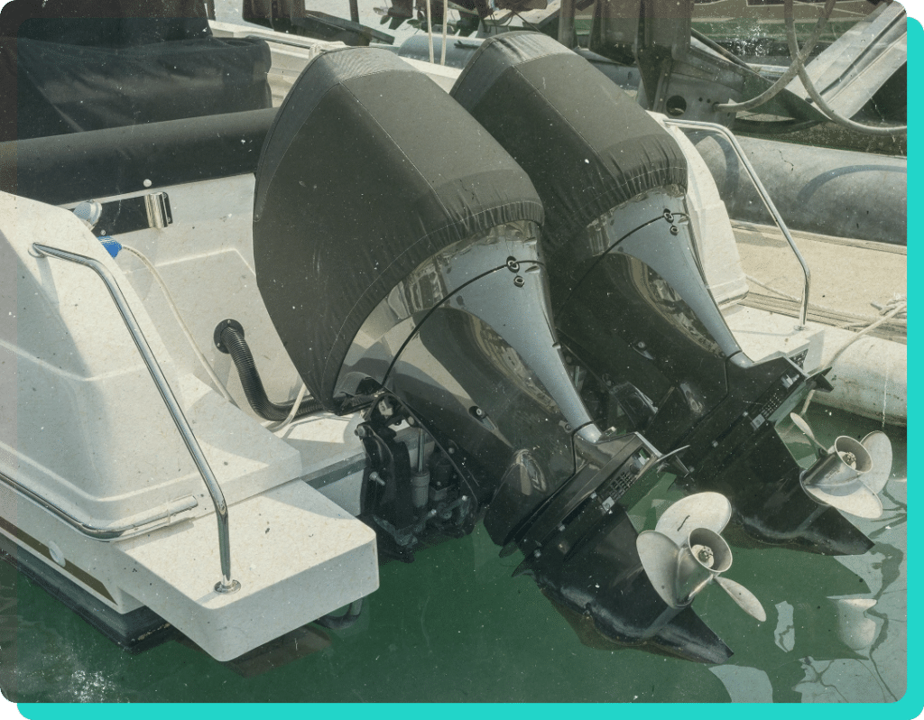 Recreational boat dual engines lifted while docked on water